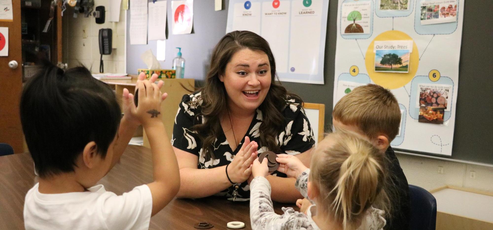 Speech teacher play with preschool